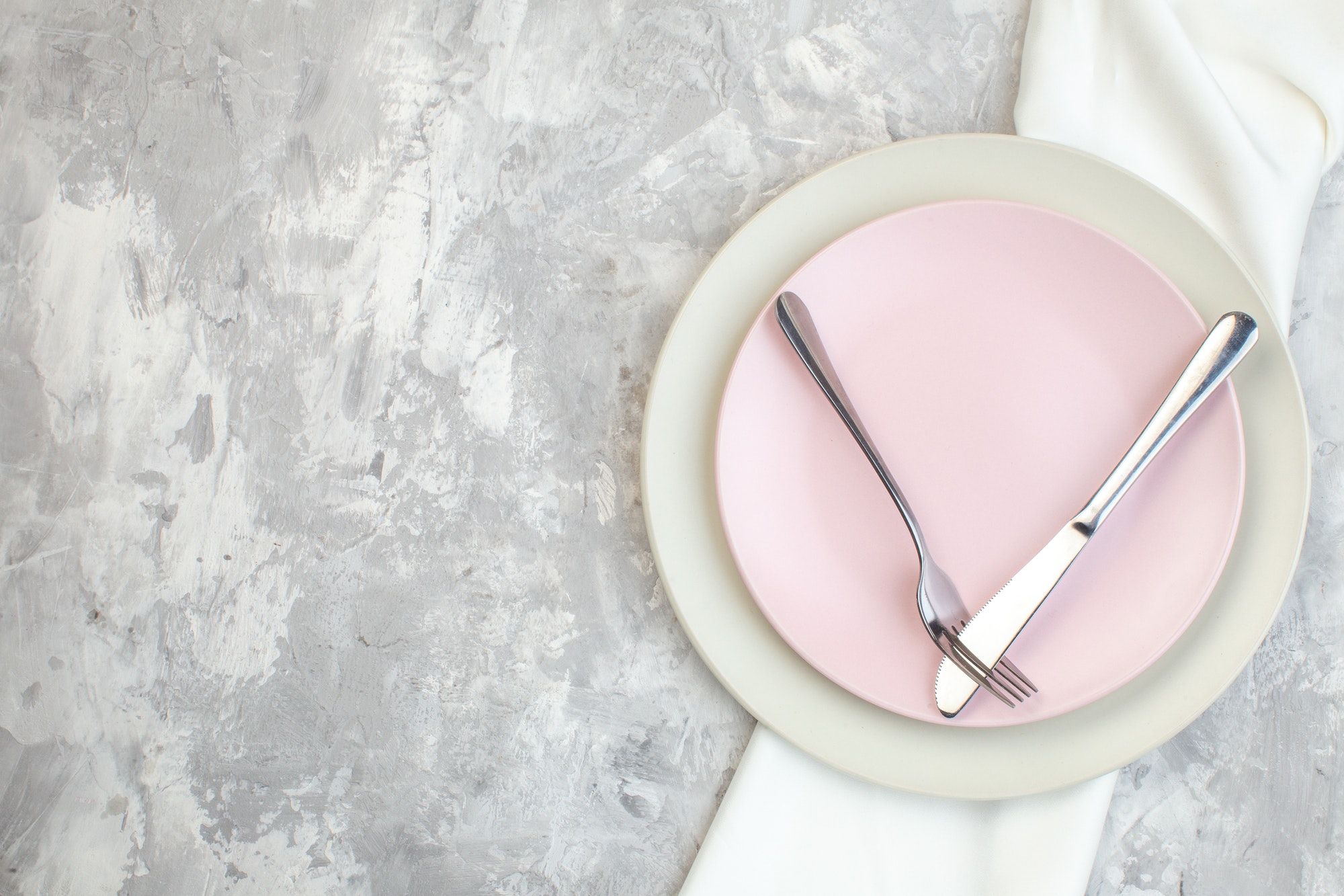 top view white plate with pink plate and cutlery on light surface kitchen glass femininity